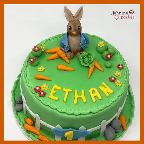 Happy 1st Birthday 💙 A Buttercream version of my Peter Rabbit Cake 🐰  Custom 1 sign @zooproductco | Instagram